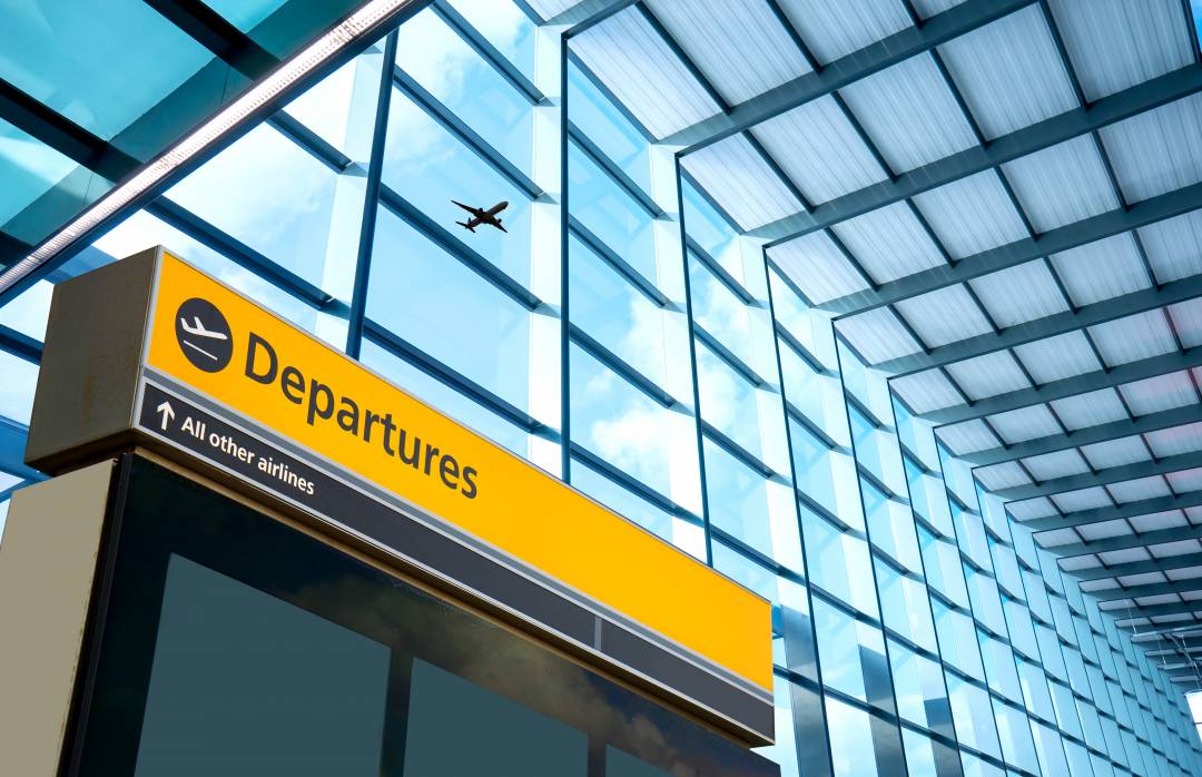 Departures sign in an airport terminal